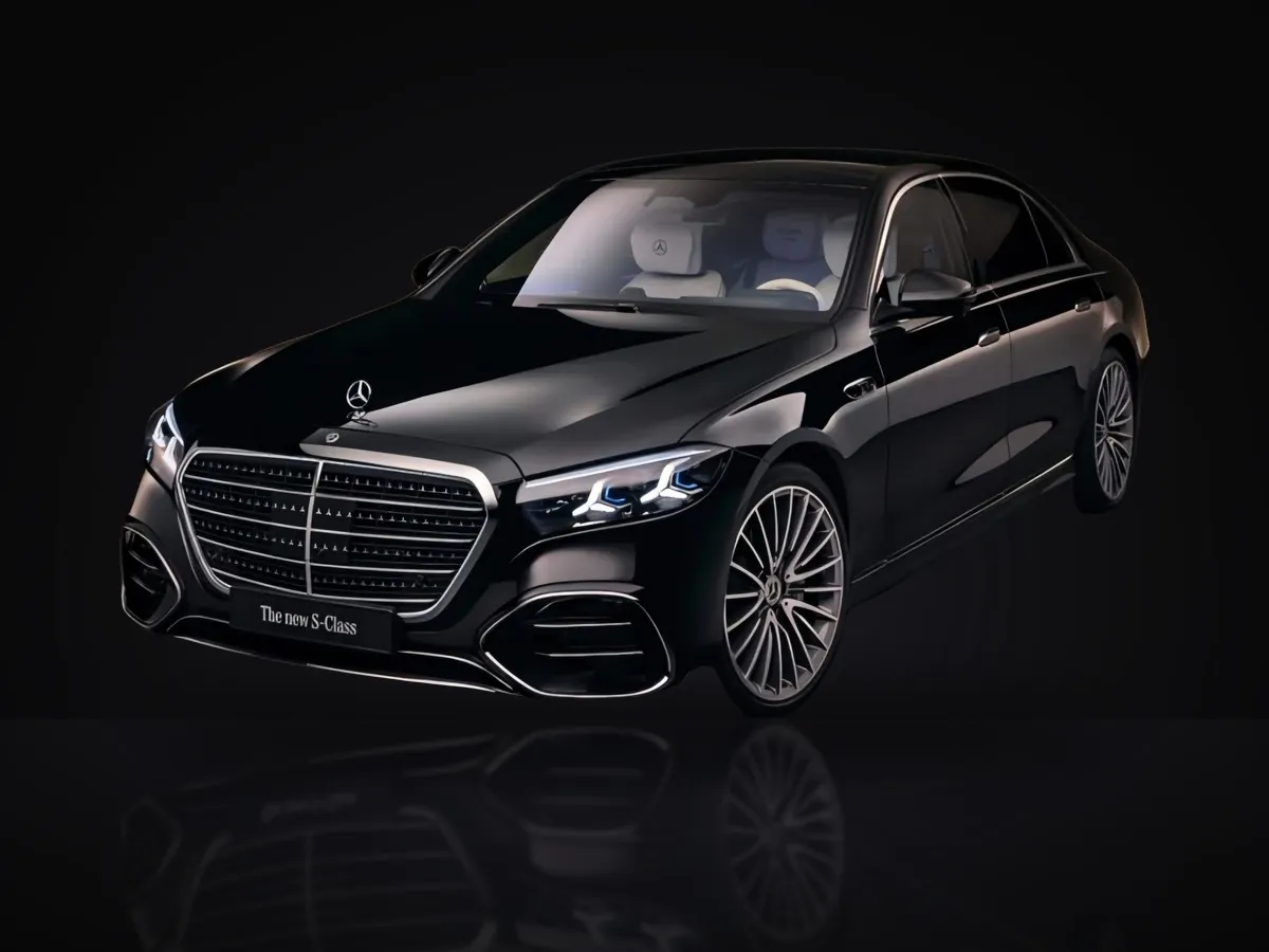 Black Mercedes-Benz S-Class luxury sedan in a studio